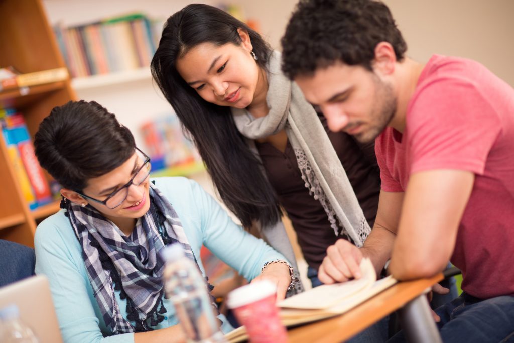 Asian student socialize with classmates in classroom